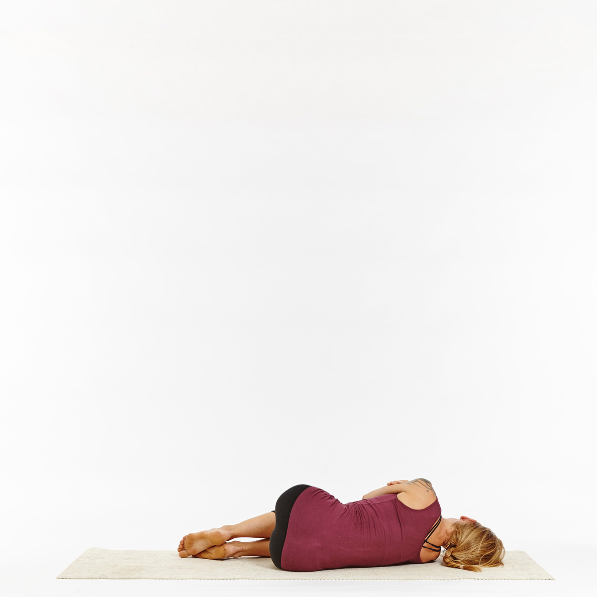 Premium Photo | Young woman lying in a rest position shavasana on the floor